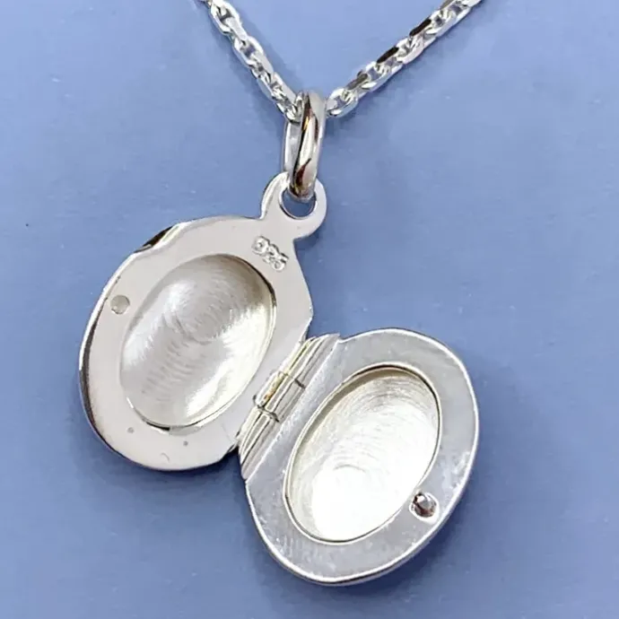 12 x 15 mm ovalt medaljon i sølv