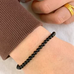 Simpel sort onyks armbånd i lærredssnor